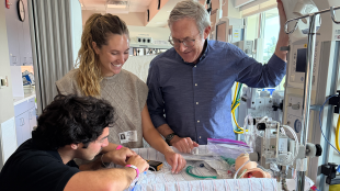 Students work with doctor in NICU