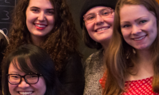 A group of people smiling