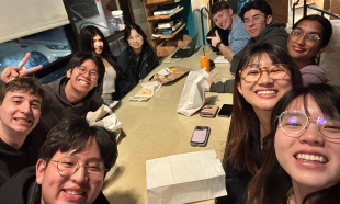 Group of students gather for donuts