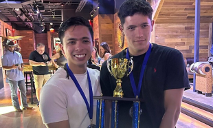 Students hold trophy at competition