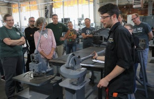People in machine shop.
