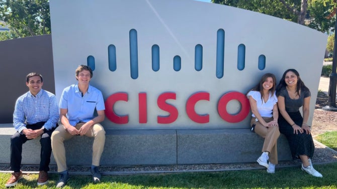 students sitting in front of CISCO