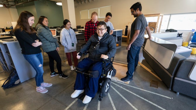 A team of Cal Poly students is working on a project that aims to create a travel-sized patient lift for aerospace engineering student Alex Fung that can be used to transfer him from his wheelchair to a standard hotel bed.