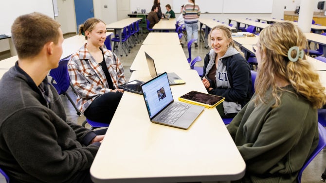 Civil and environmental engineering graduate students meet in small groups to practice short presentations on their thesis topics in their Graduate Seminar II class.