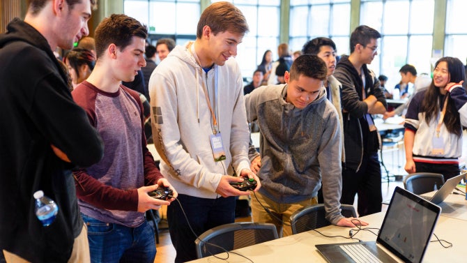 Students collaborate during a hackathon, developing projects and testing ideas in a fast-paced, team-based setting.