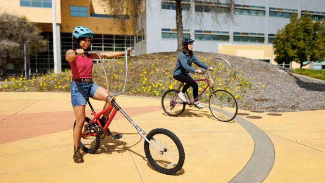 Students take part in a parade of student-built bikes.