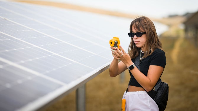 student takes measurements at the 4.5 MW Gold Tree solar field on Cal Poly’s campus with the ultimate goal of optimizing the solar field’s energy generation.