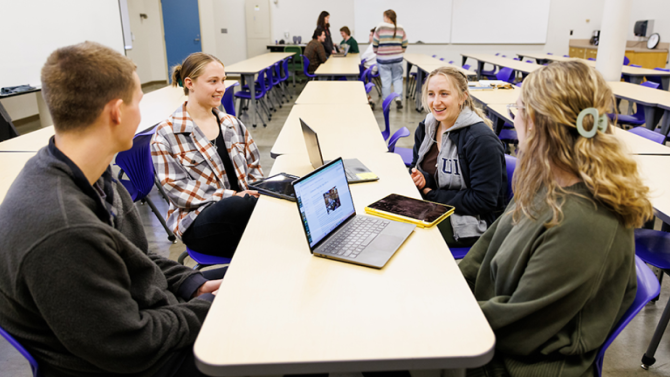 Students collaborate in a College of Engineering classroom. New faculty scholars Puneet Agarwal and Jiun-Yao Cheng will help guide the responsible integration of artificial intelligence across the college’s programs.