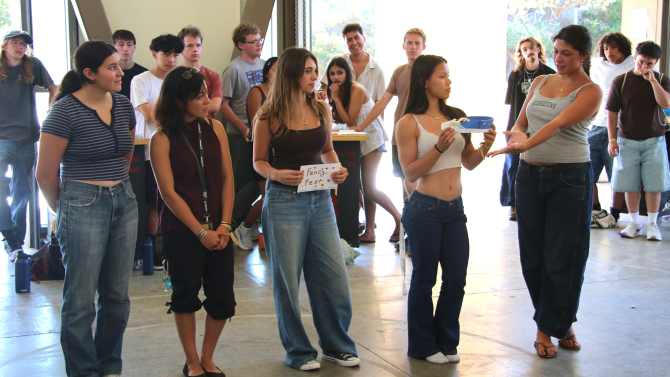 Students pitch their shoe during a WOW event