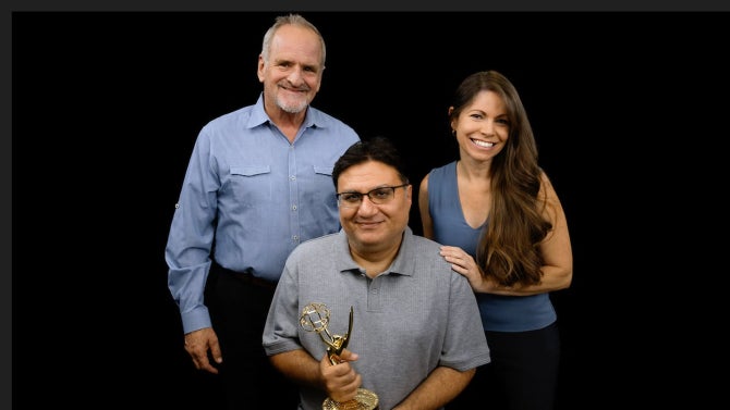 Trio poses for group shot with Emmy statue