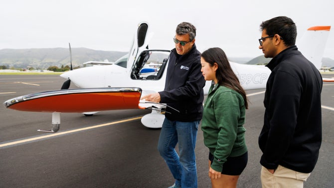 Students in aerospace engineering professor Paulo Iscold’s class learn the ins and outs of one of Cal Poly’s plane.