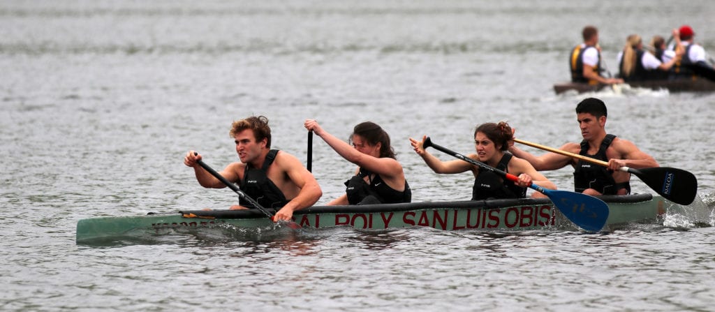 Students rowing a canoe.