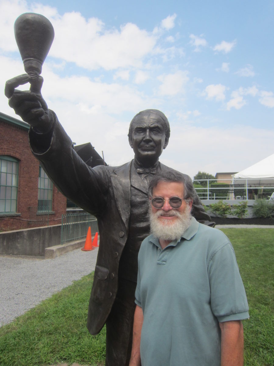 Man in front of statue