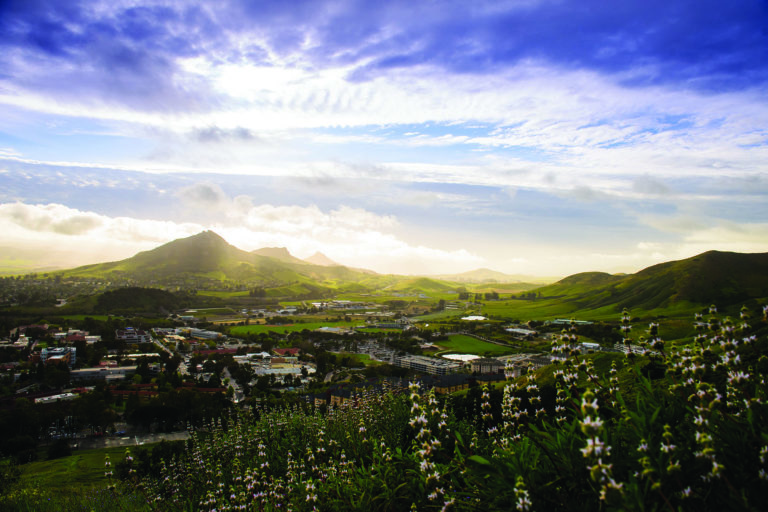 View of campus with sun setting over Bishop's Peak