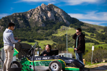FSAE team with formula car and Bishop's Peak in the background