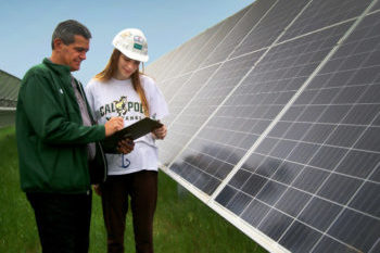 Professor and student working with solar panel