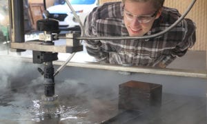 Male student and a waterjet