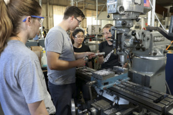 QL + students working in machine shop