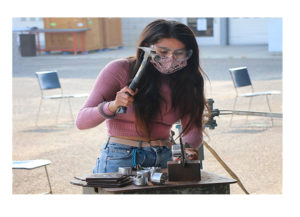 Student working with hammer
