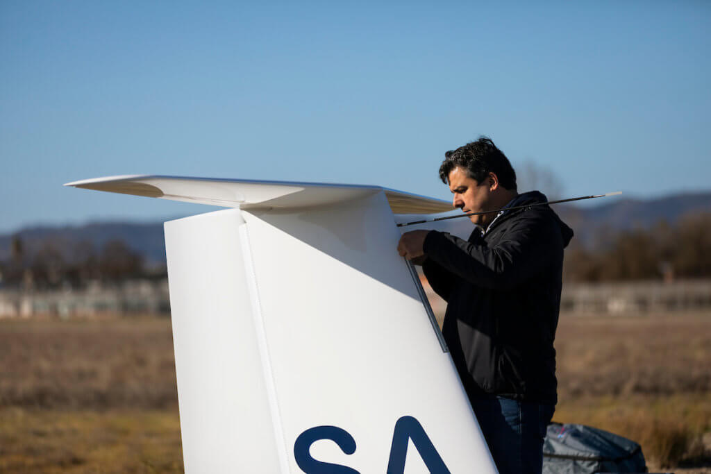 Aerospace Engineering Professor Paulo Iscold works on a sailplane he designed
