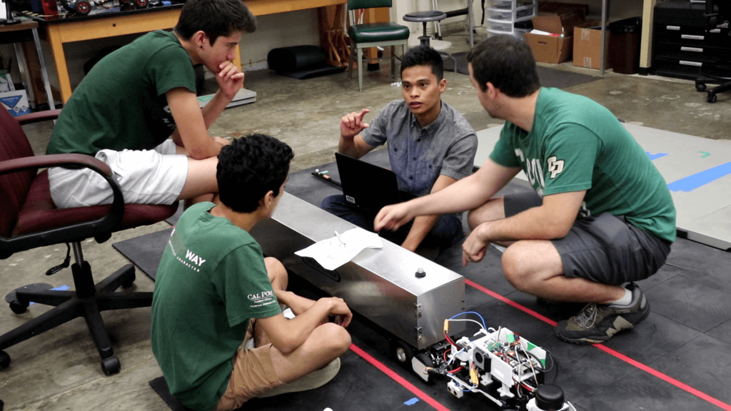 Students discuss their summer undergraduate research prject at Cal Poly
