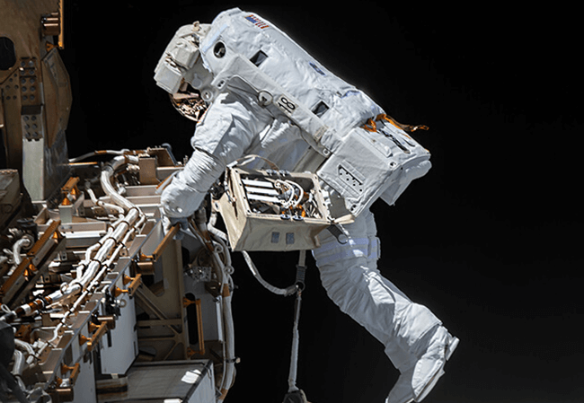Astronaut and GENE alumnus Victor Glover taking a spacewalk outside of the International Space Station