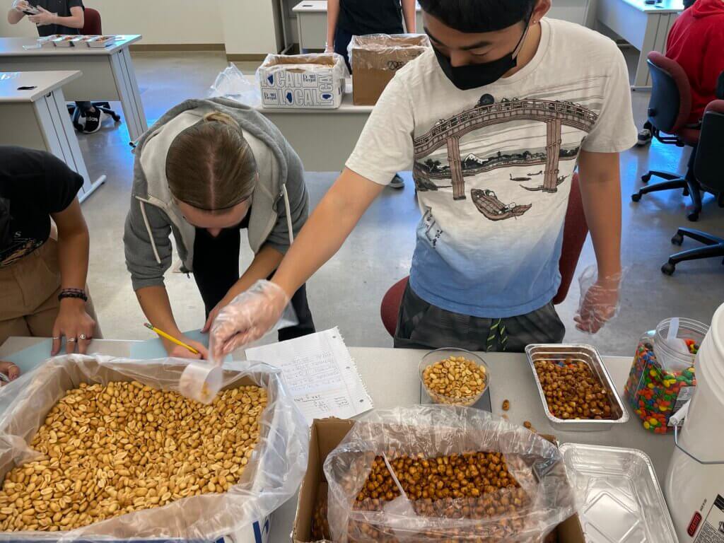 Three sections of an IME 101 class created trail mix packets for the Cal Poly Food Pantry. The class is expected to continue assisting the Food Pantry in the future. 