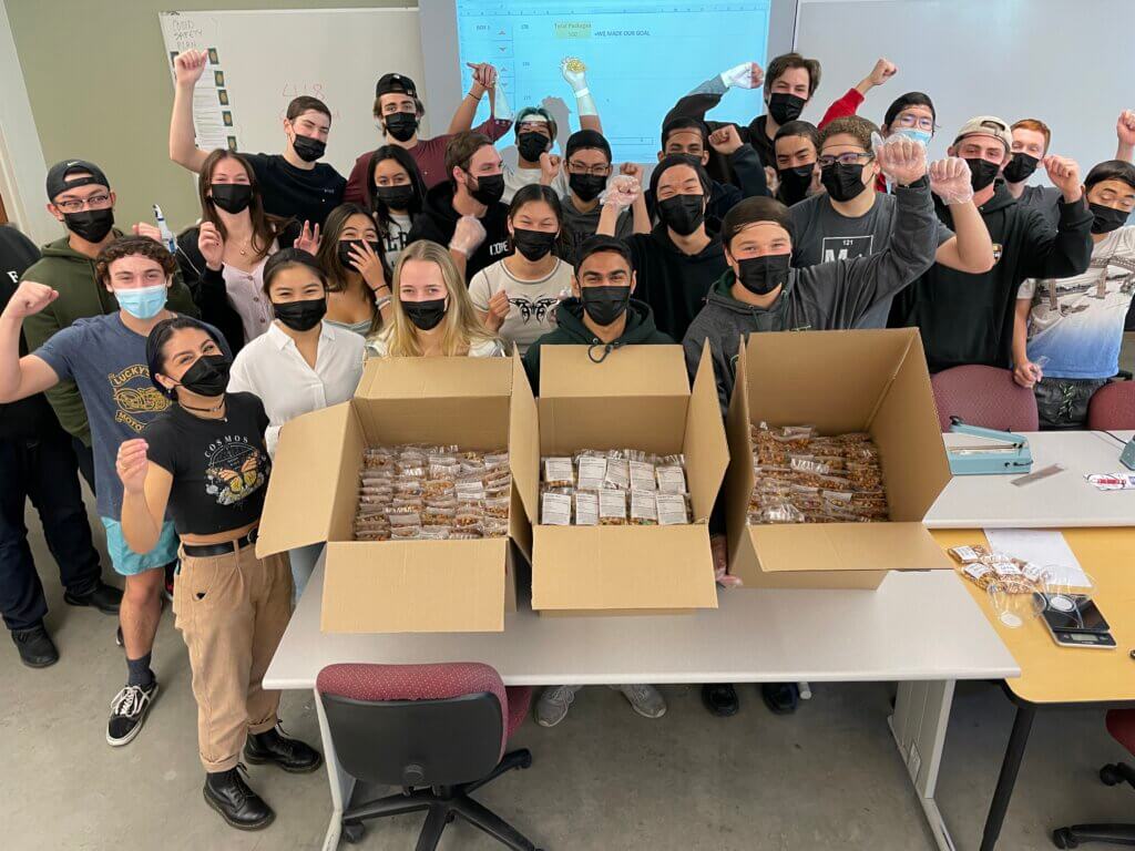 Students in IME 101 learned to maximize production while assisting food insecure students with 2,300 trail mix packages they delivered to the Cal Poly Food Bank.