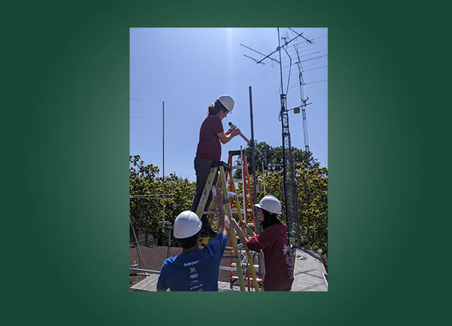 Students fixing radio tower