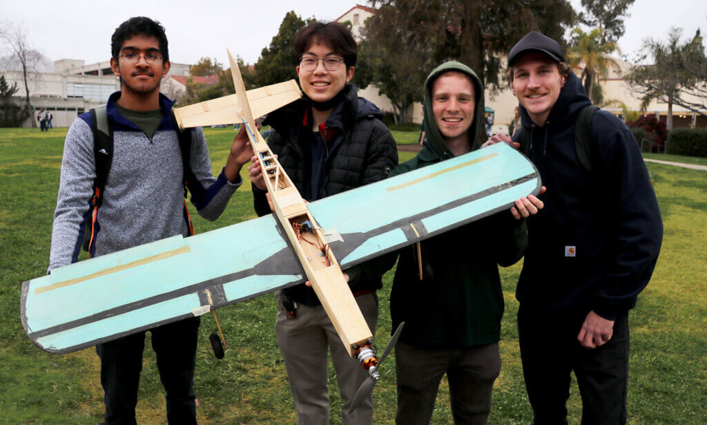 Students with plane model