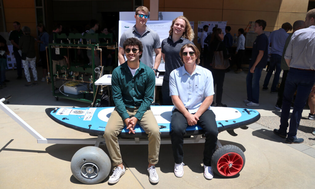 Seniors display their surf sled at the senior project expo