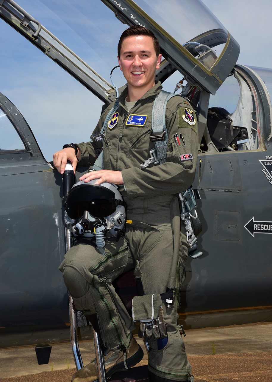 Pilot poses next to a jet before getting into the cockpit