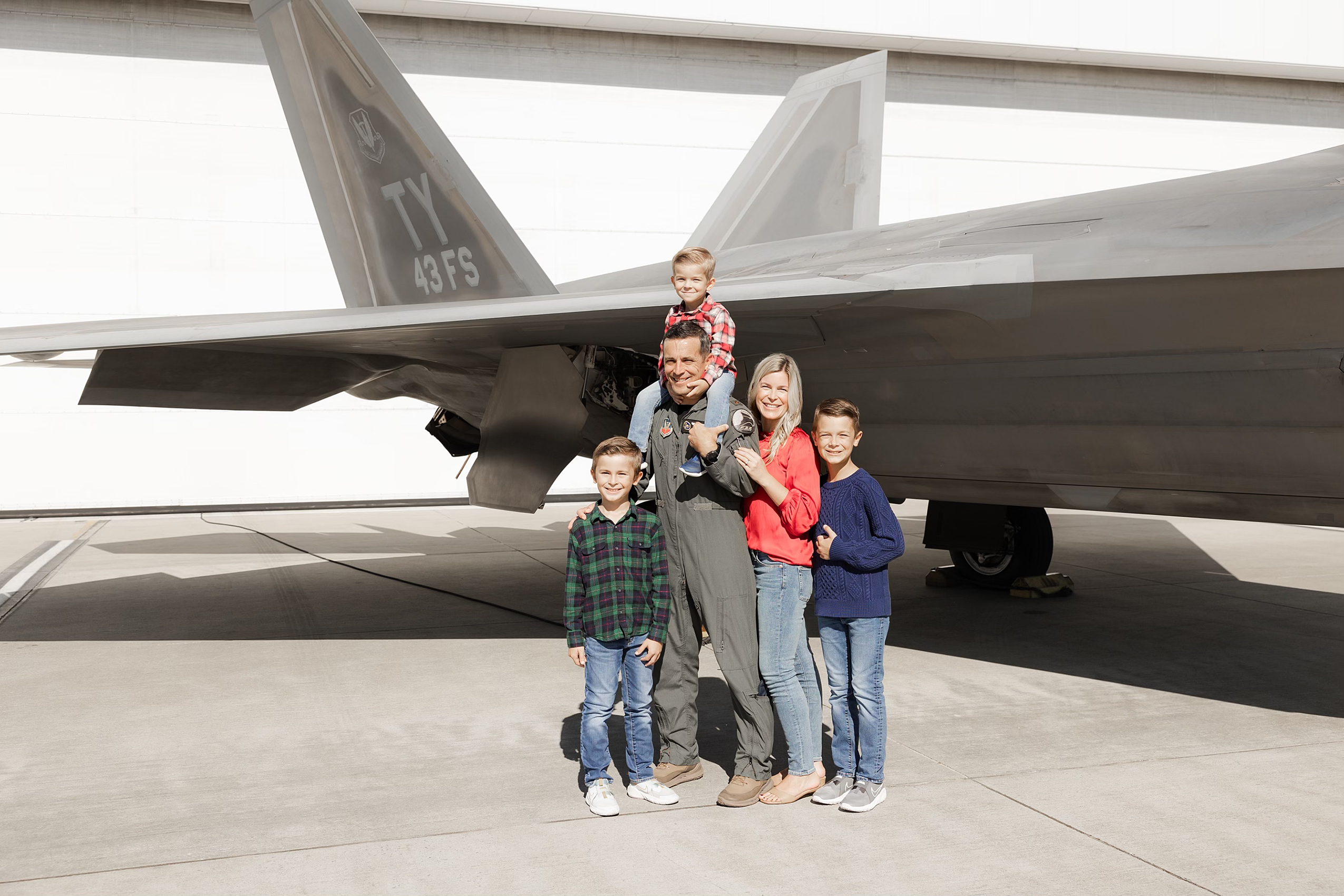 Fighter pilot poses with his family
