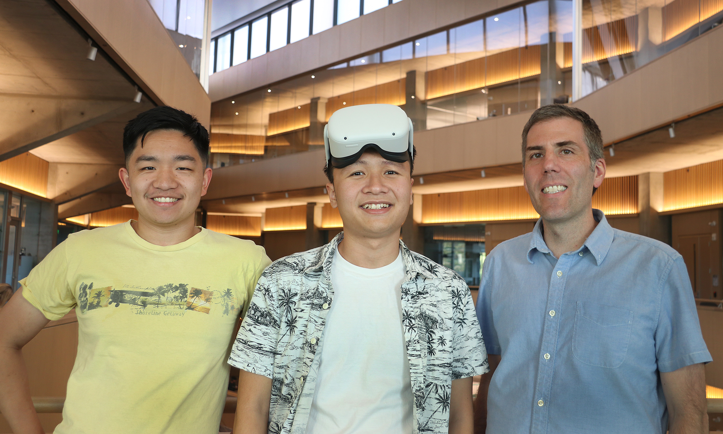 Professor Ventura poses with two students who are working with him on virtual reality projects