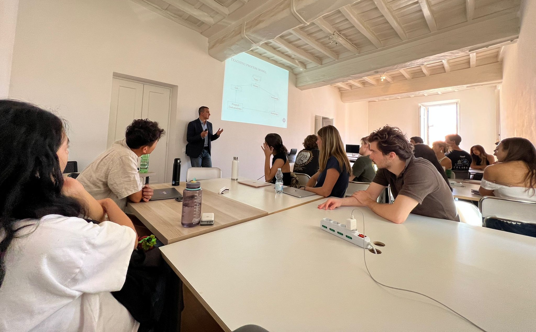 Professor teaches students in a classroom located in Rome