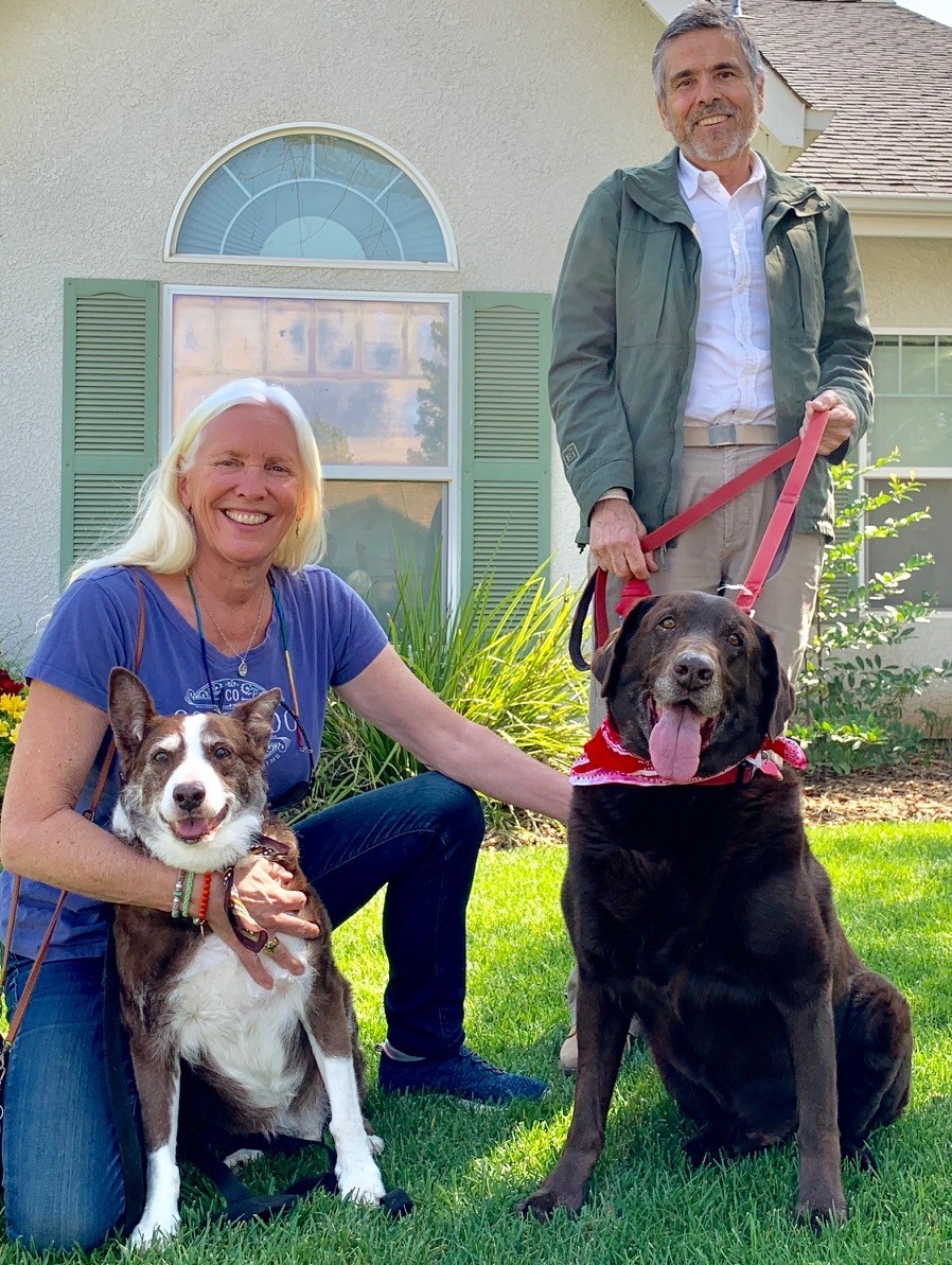 Lori and Gene Fisher pose with their dogs