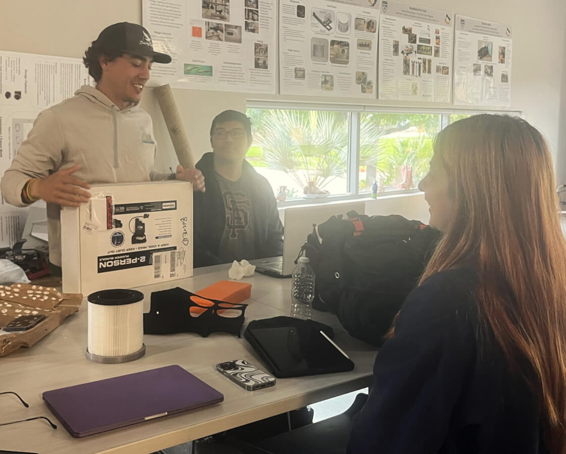 Three students discuss their senior project in the TECHE Lab