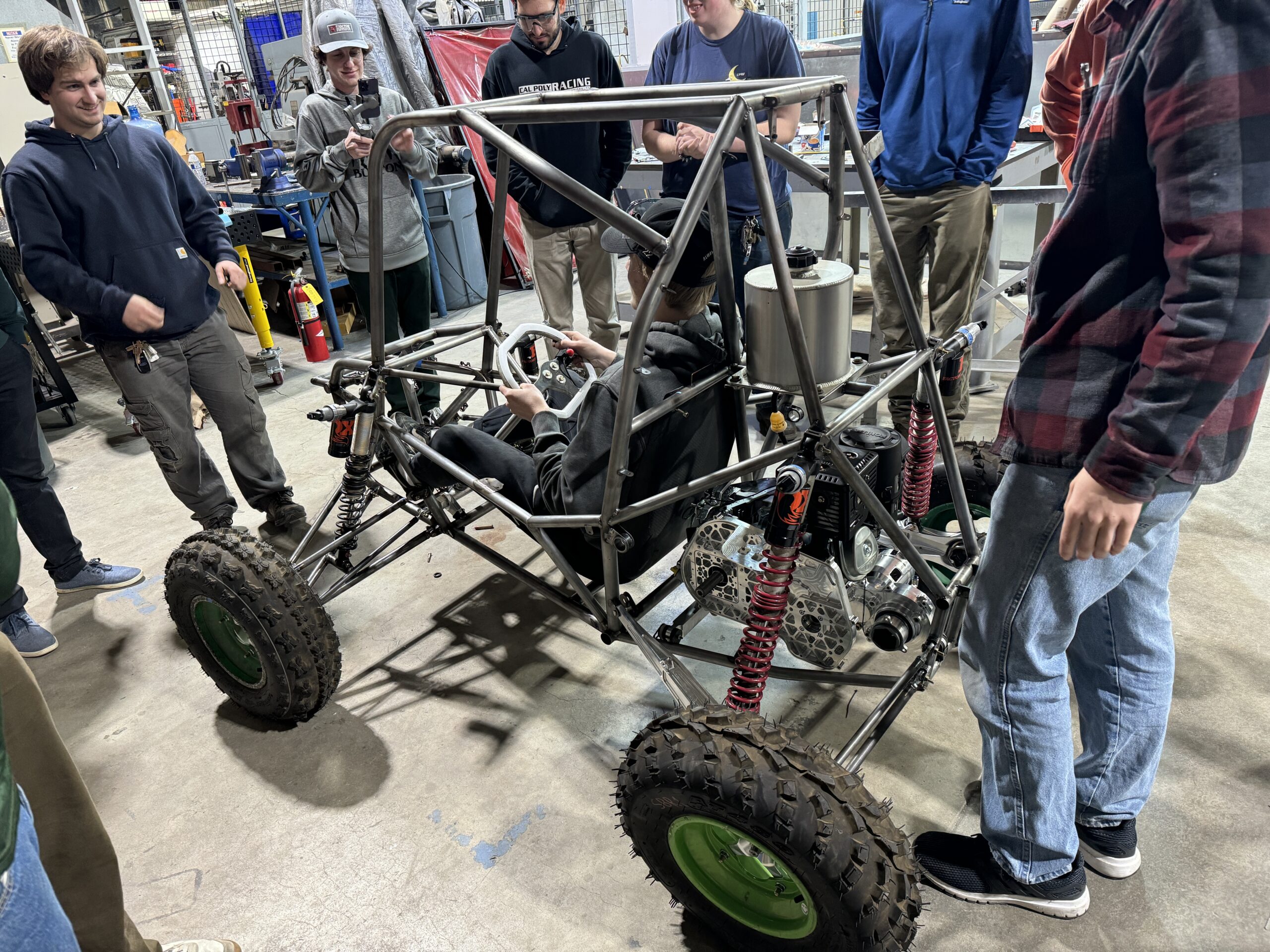 Students put the vehicle on the ground for the first time in the Hangar machine shop