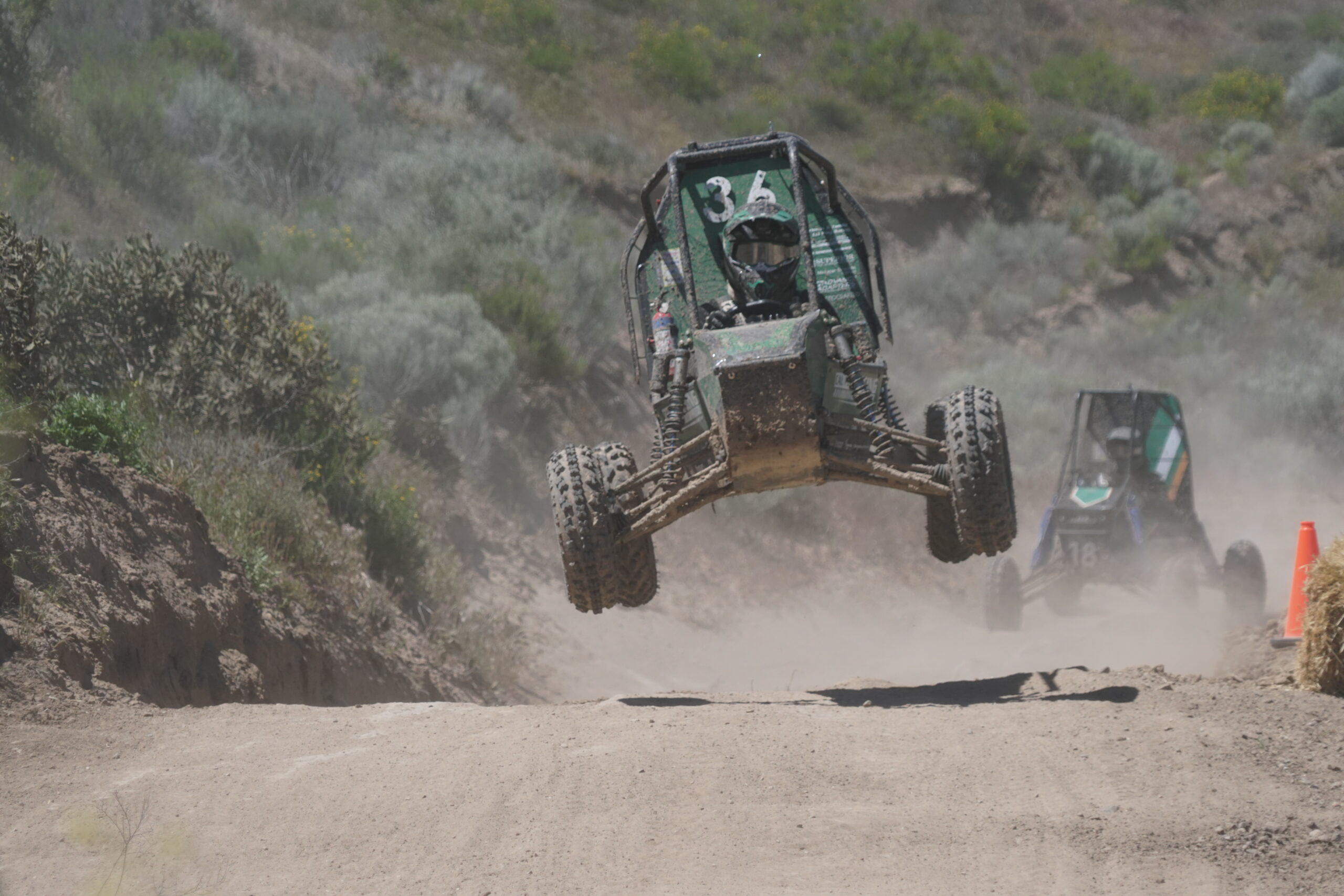 Baja SAE vehicle clears an obstacle on the off-road course