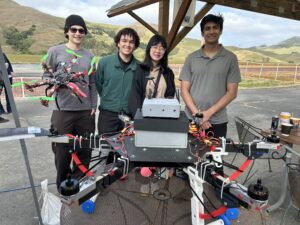 Four students with their drone