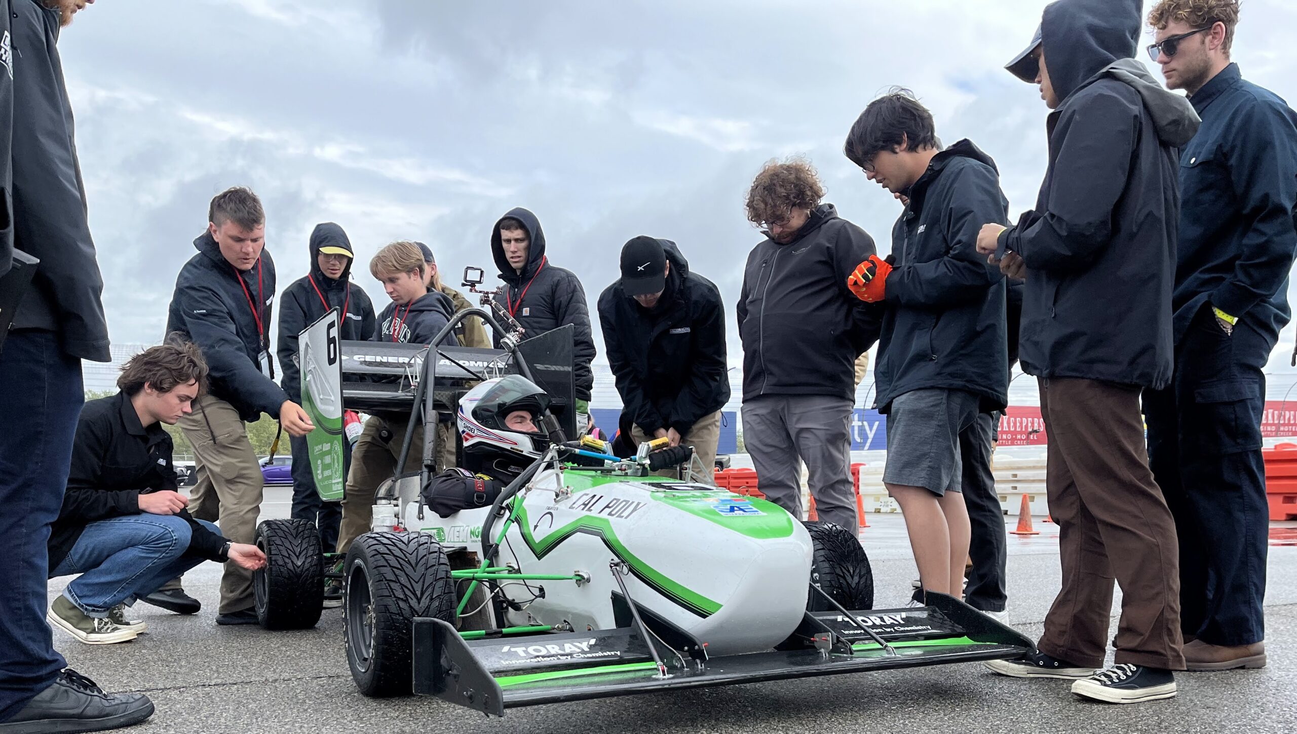 Crew members prep the Formula car for competition