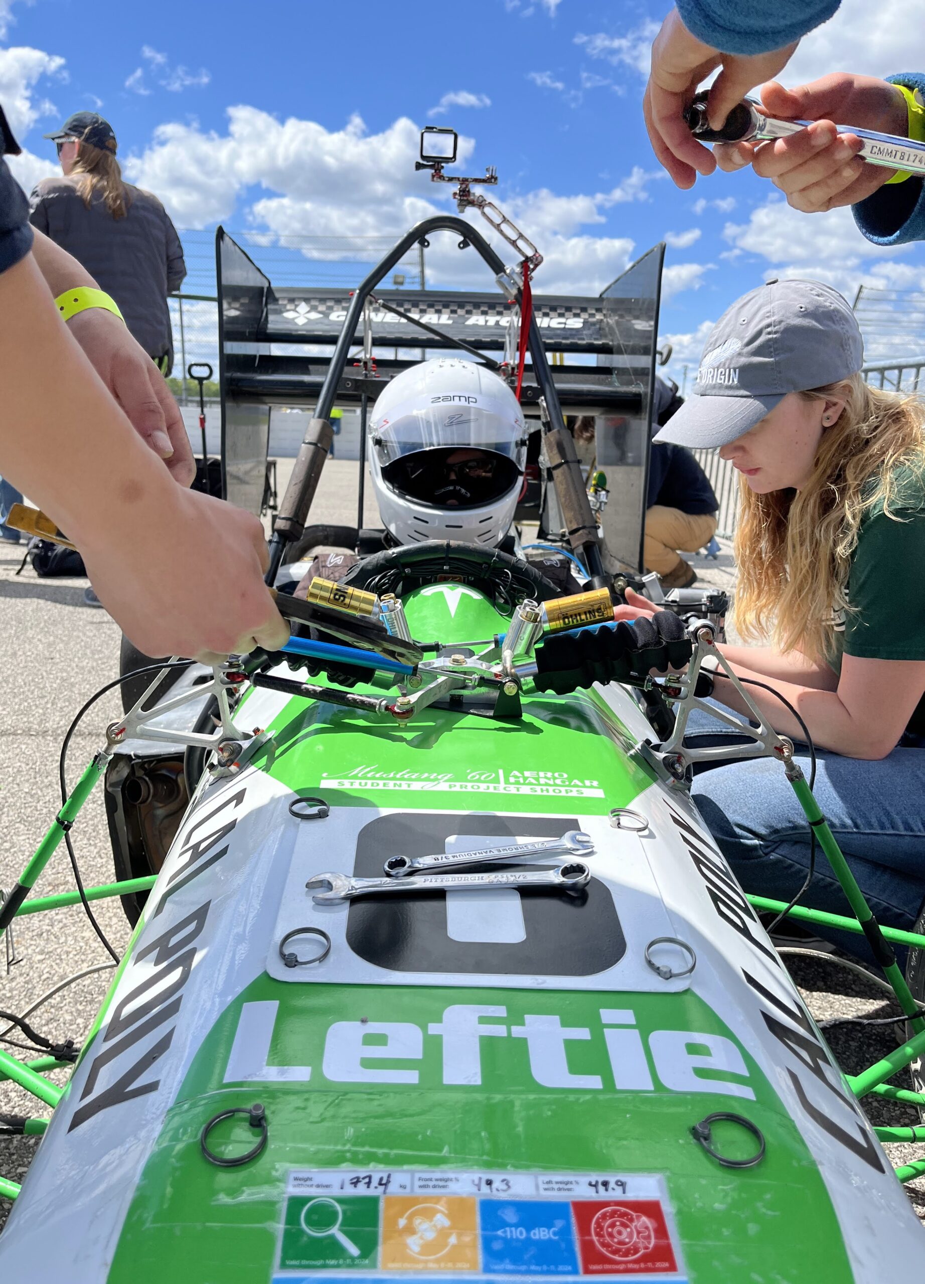 Cal Poly Racing' Formula crew prepares their car for competition