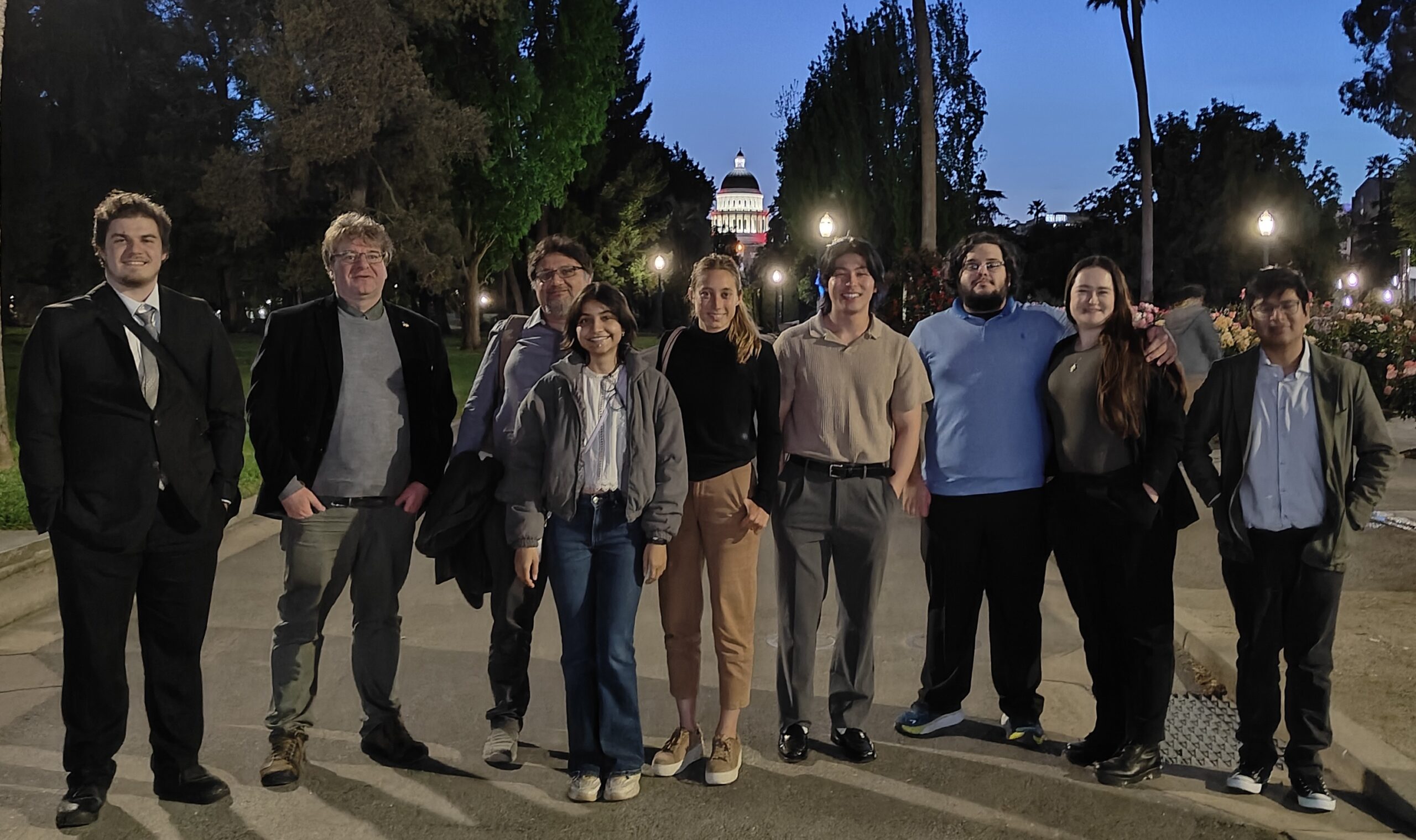 Group from Cal Poly stands in front of the state Capitol 