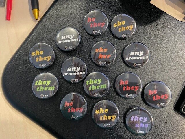 Buttons that have a variety of pronoun options listed on them