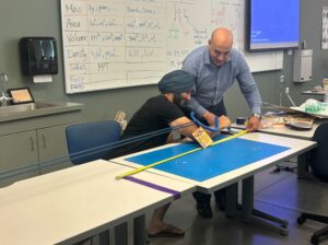 Grad student measures arm strength in EPIC lab