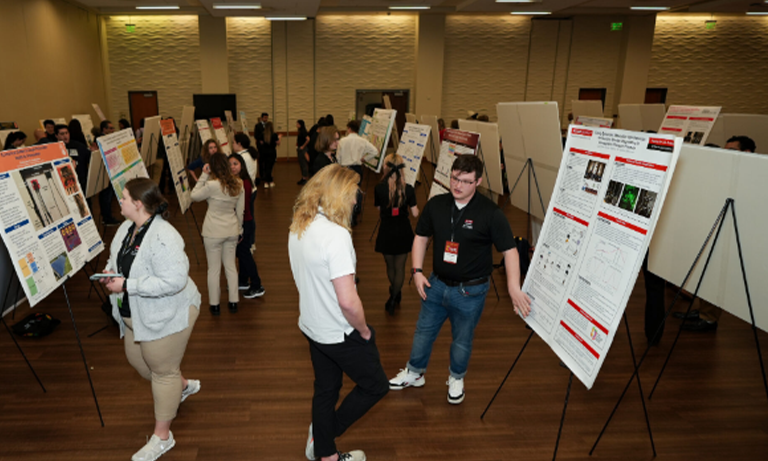 Students at a poster symposium