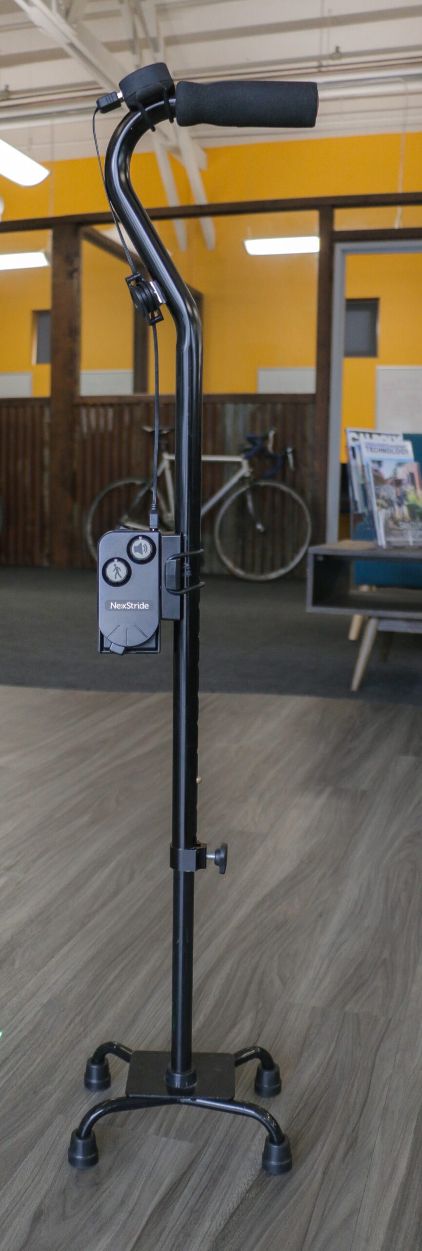 Closeup of the NexStride device attached to cane