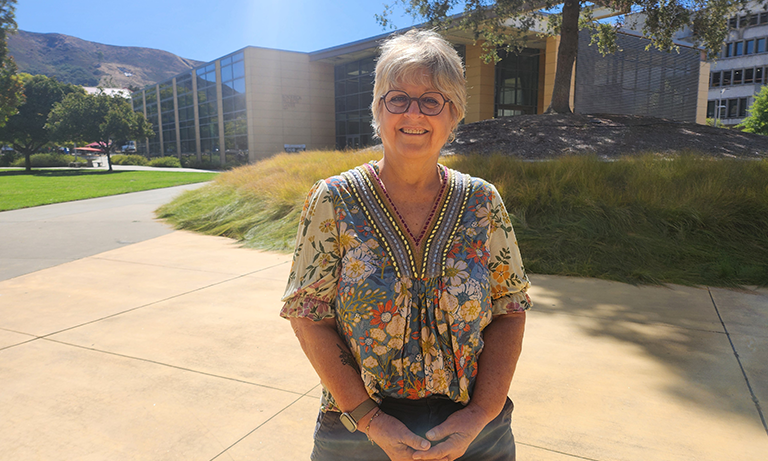 Staff member Stephanie Allen posing in the Engineering quad.