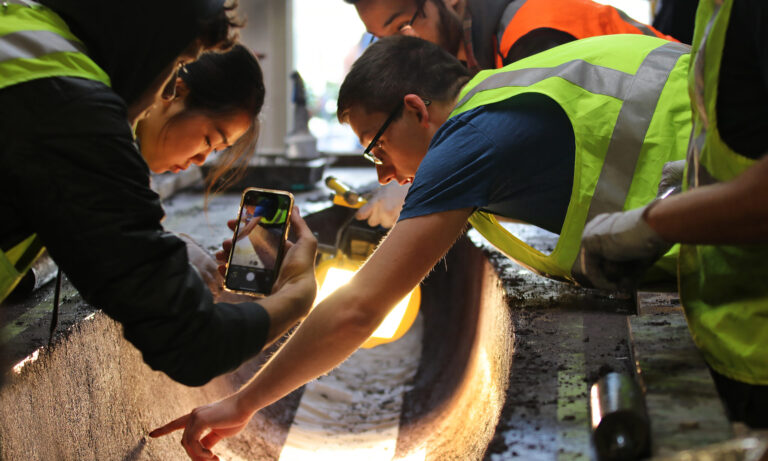 Students cast their concrete canoe