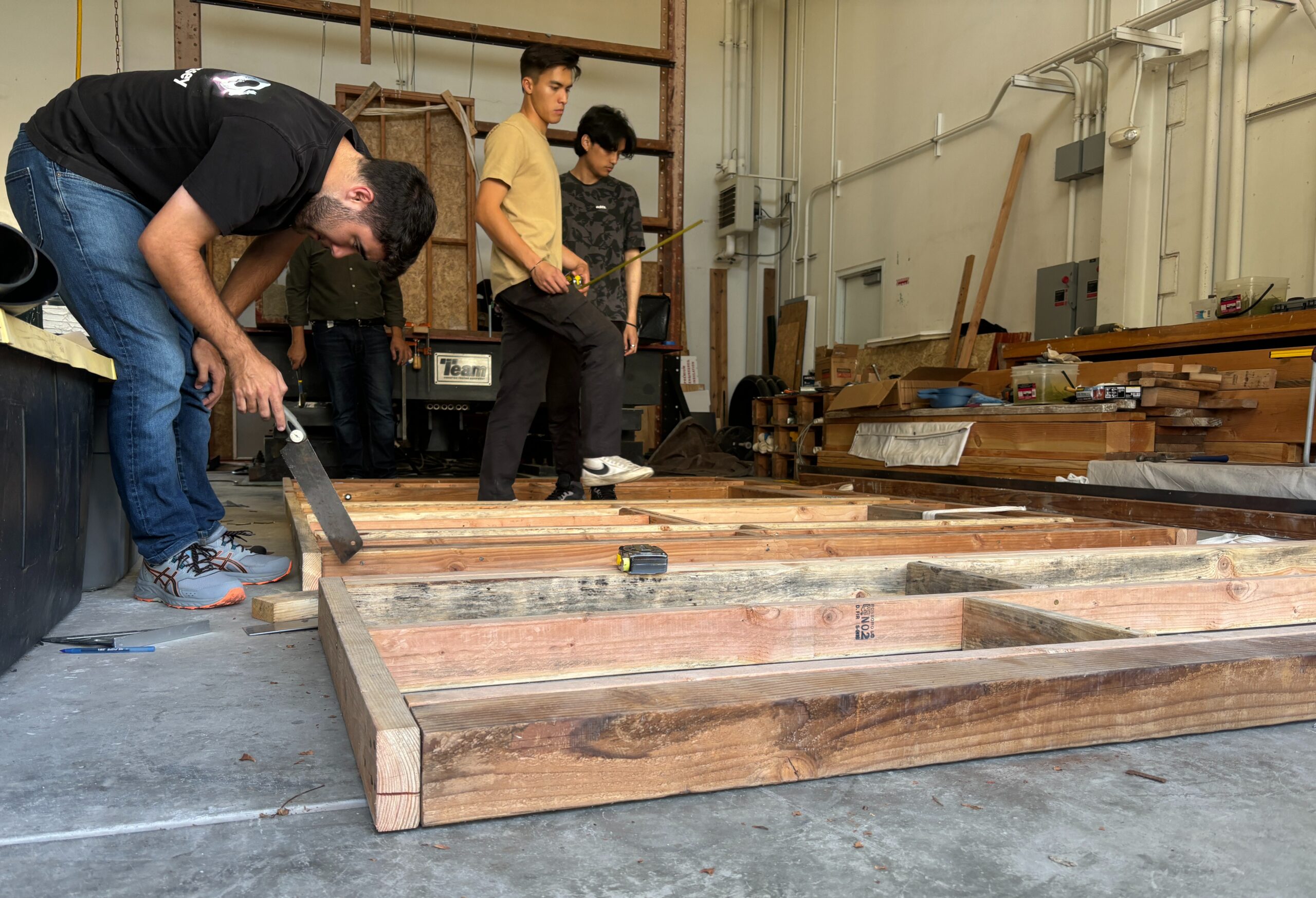 Students work on constructing a timber structure for testing on the shake table